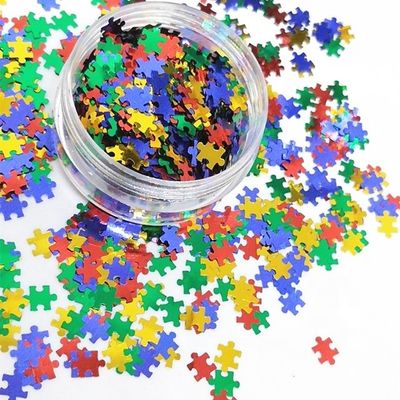 Die Cutting Printing PET Puzzle Glitter Shape for Eye-Catching Puzzle Designs in Red Blue Yellow Green Mix